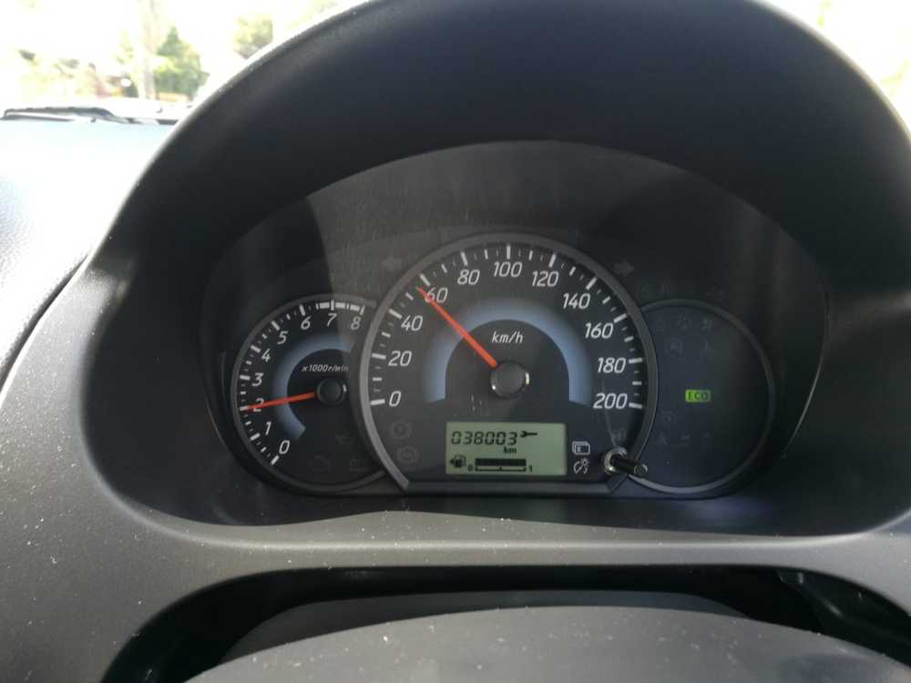 the dashboard of a Mitsubishi Mirage car with eco mode indicator on